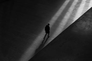 man walking alone concept image about Opioid Addiction