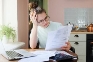 Woman figuring out finances by herself - Decrease Addiction Risk