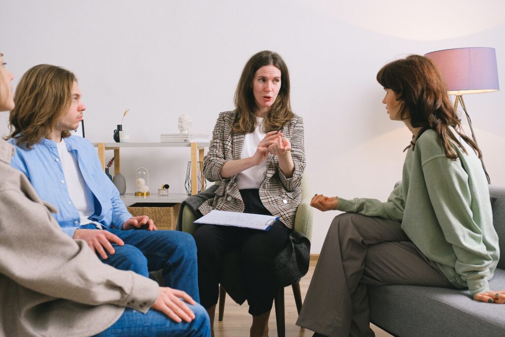woman having group counseling - intensive outpatient program concept
